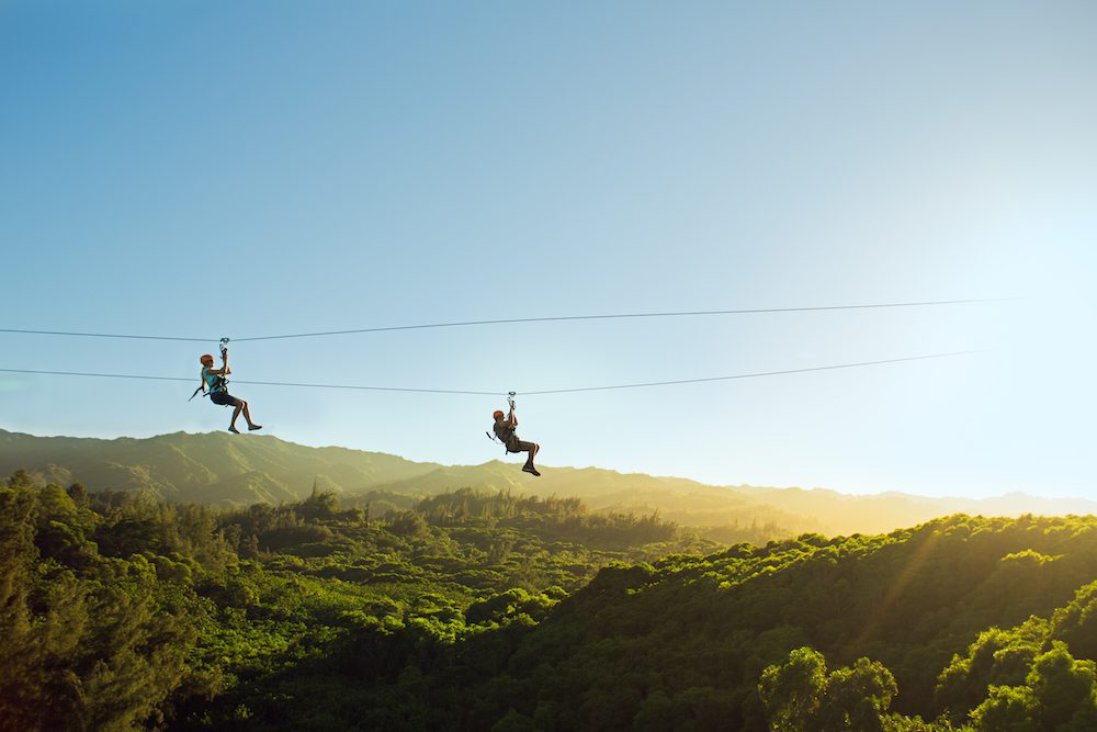 Two-people-enjoying-an-Oahu-zipline-tour