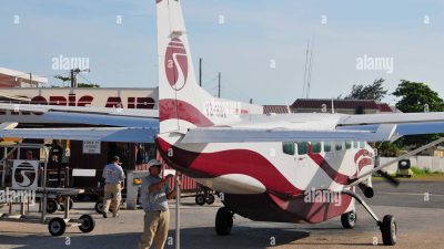 An small Island hopper plane lands at the tiny San Pedro airport on Ambergris Caye, a top bonefishing/tourism spot in Belize