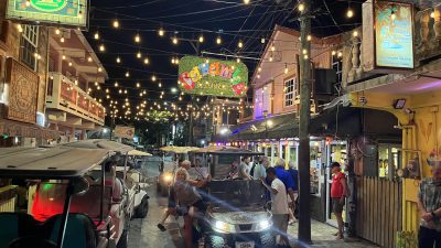Golf carts on a street in San Pedro, Ambergris Caye