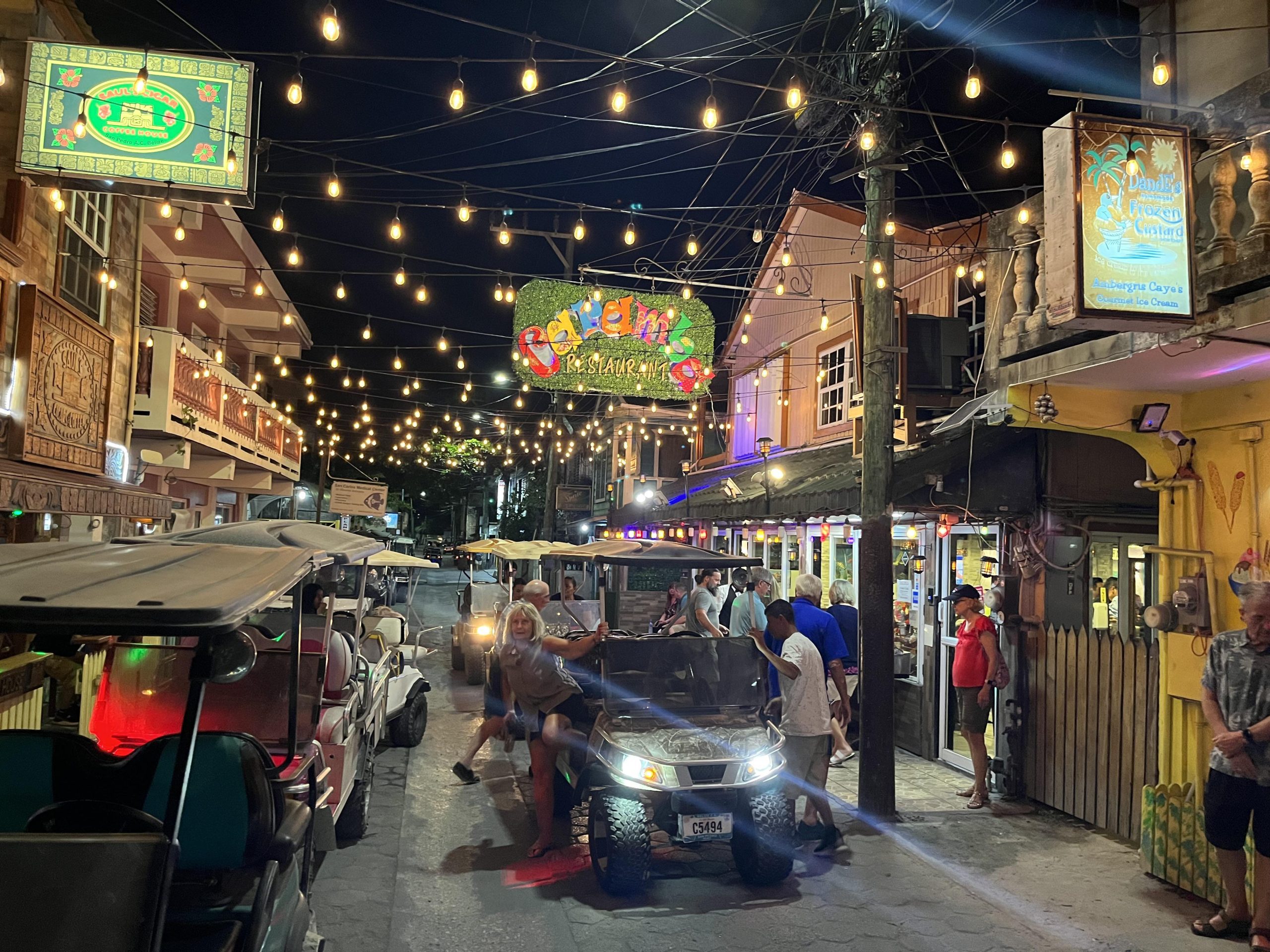 Golf carts on a street in San Pedro, Ambergris Caye