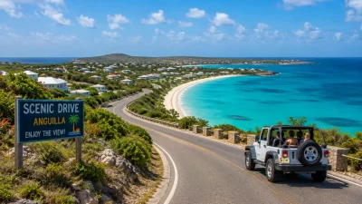 A scenic overlook of a road winding down to a turquoise bay in Anguilla