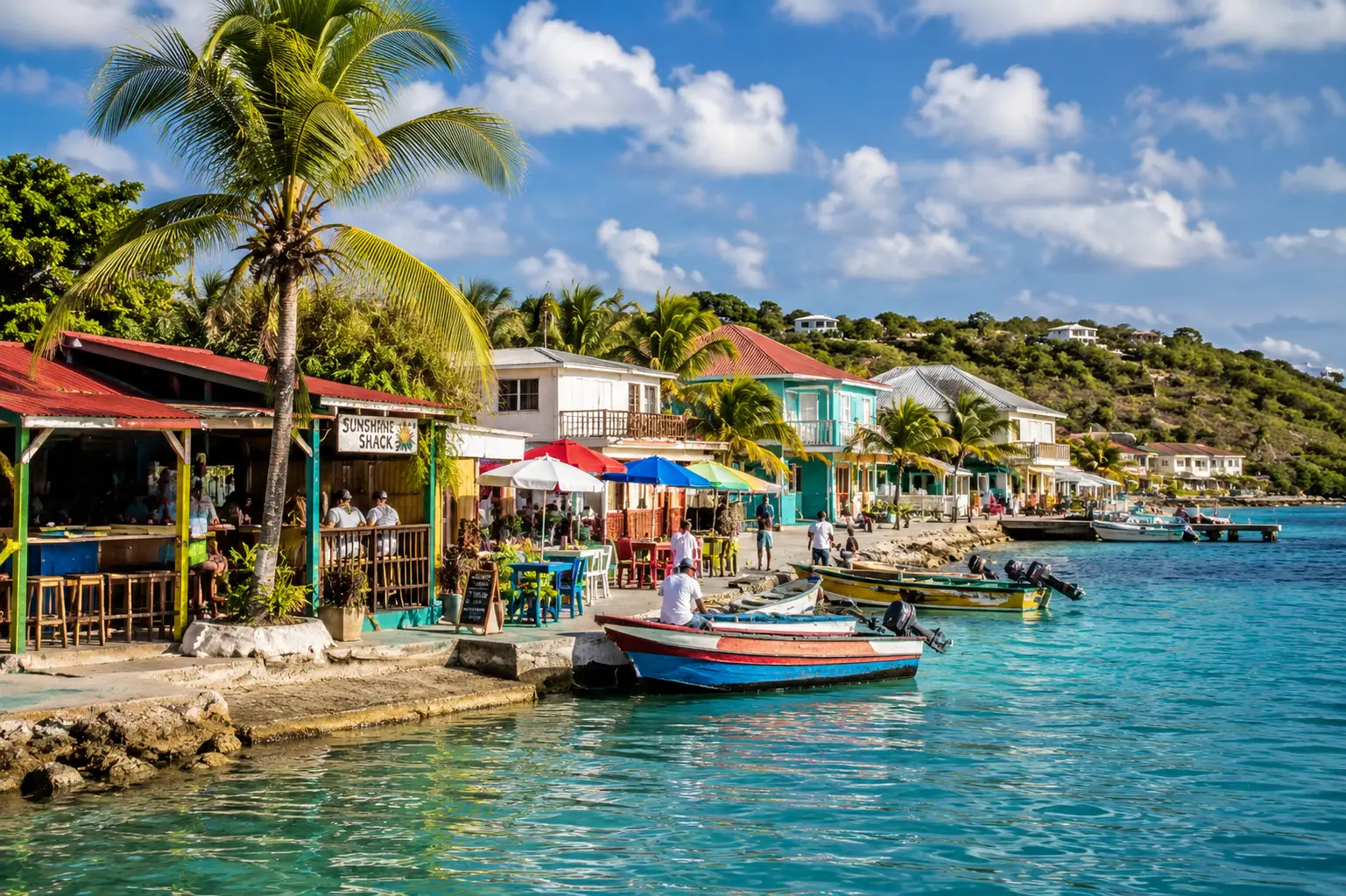 A beachfront bar and dock in Anguilla with colorful fishing boats
