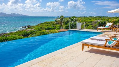 Infinity pool overlooking the coastline at a private villa in Anguilla