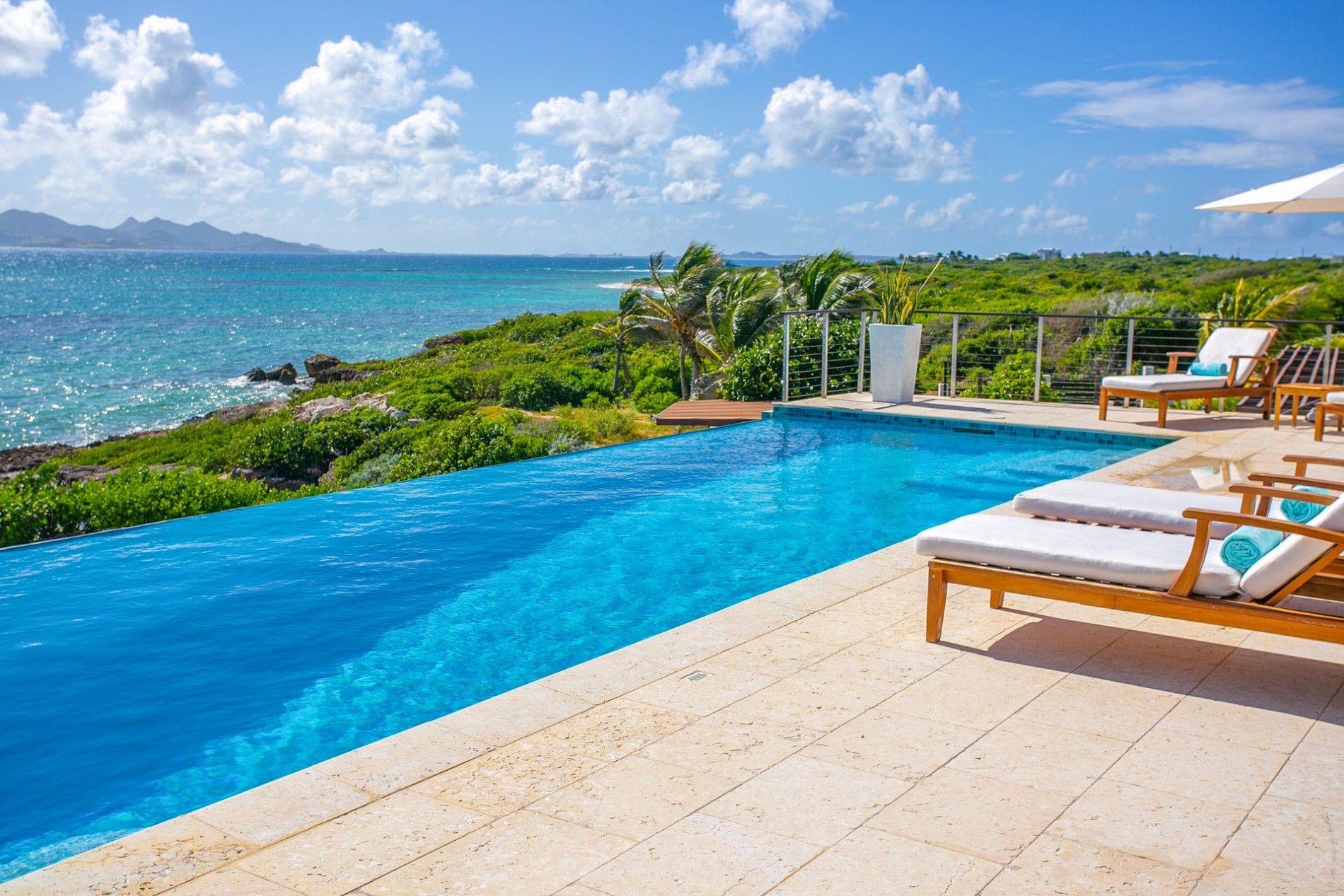 Infinity pool overlooking the coastline at a private villa in Anguilla