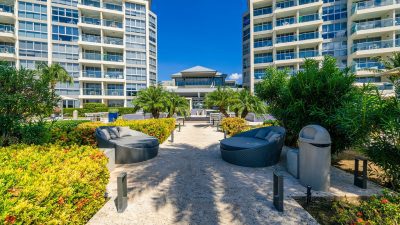 Condo towers and garden path at an Eagle Beach resort in Aruba, the kind of layout that works well for multigenerational families