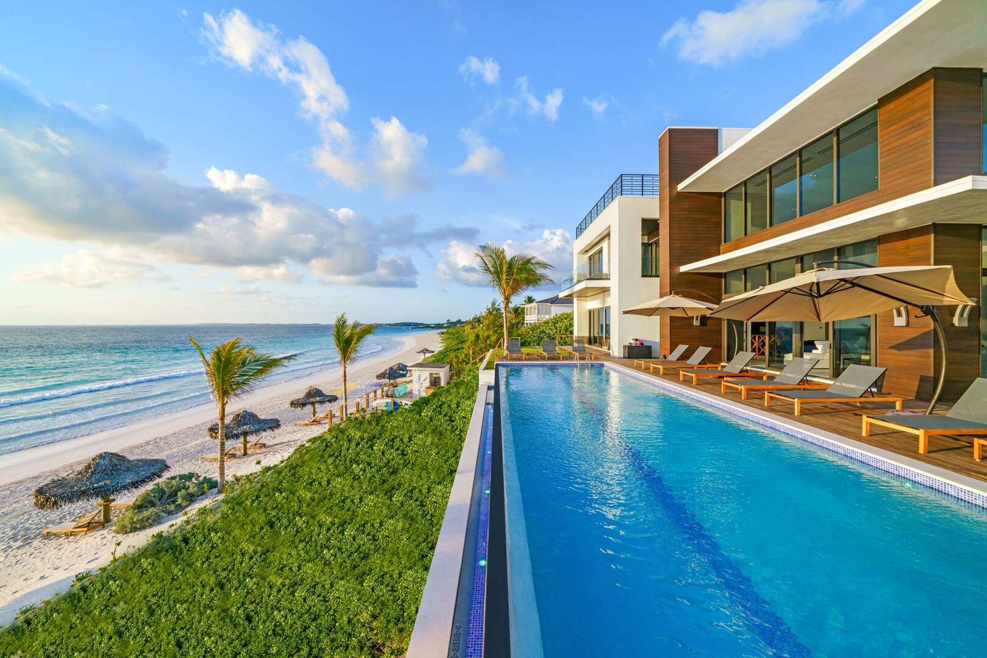 A beachfront villa with a private infinity pool overlooking the ocean, the kind of layout that suits multigenerational Bahamas trips