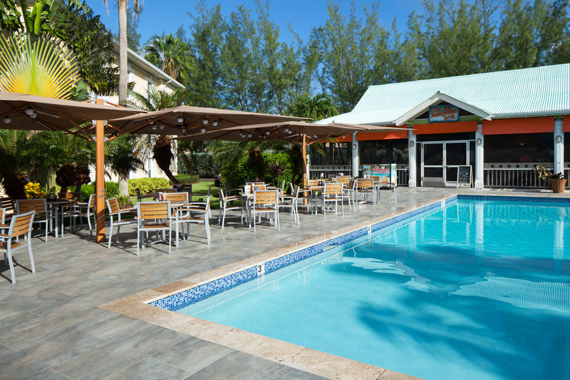 Sunshine Suites Resort pool and outdoor dining area