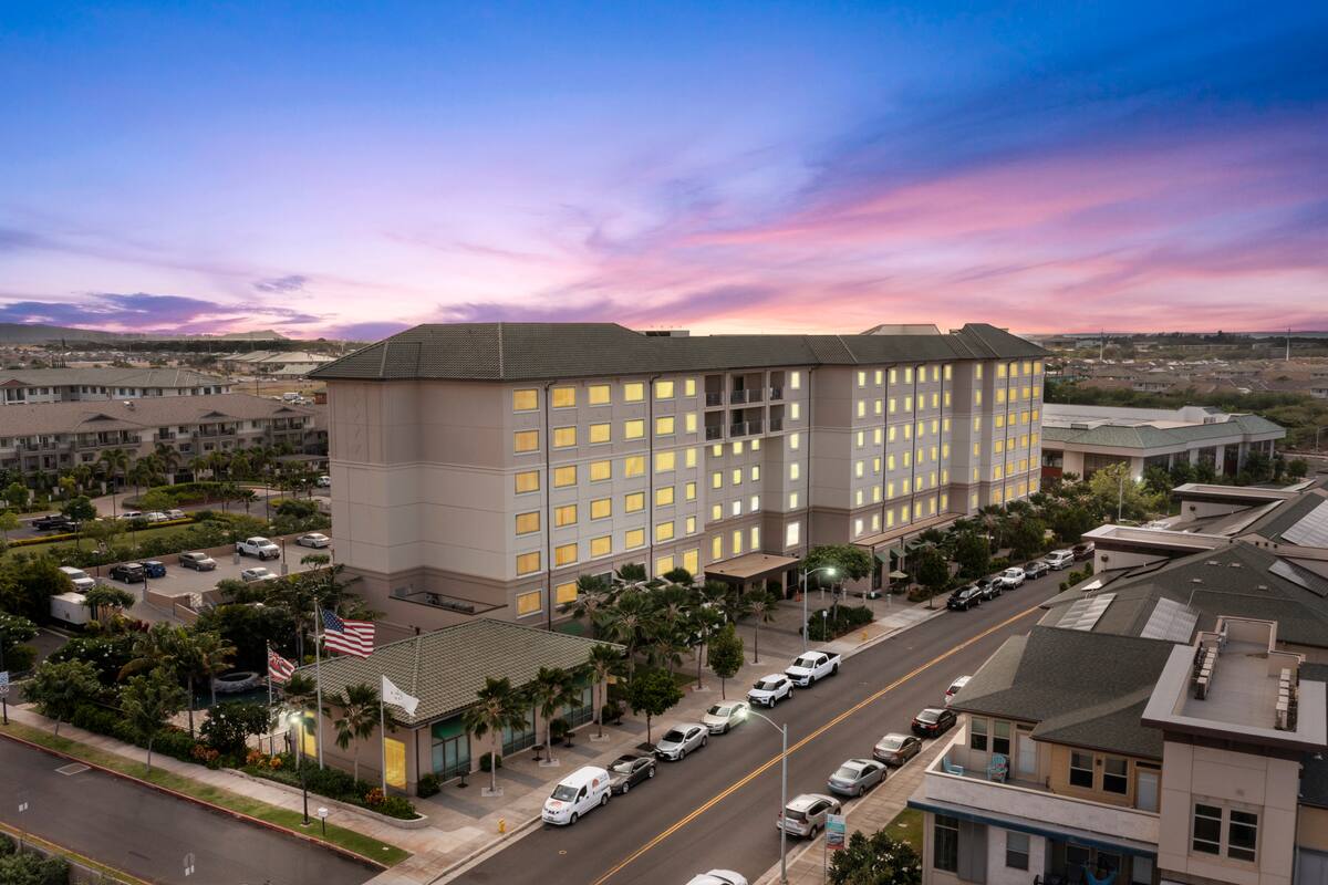 Embassy Suites by Hilton Oahu Kapolei exterior at dusk