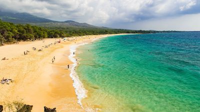 Scenic Maui beach with calm turquoise water, ideal for families with young kids