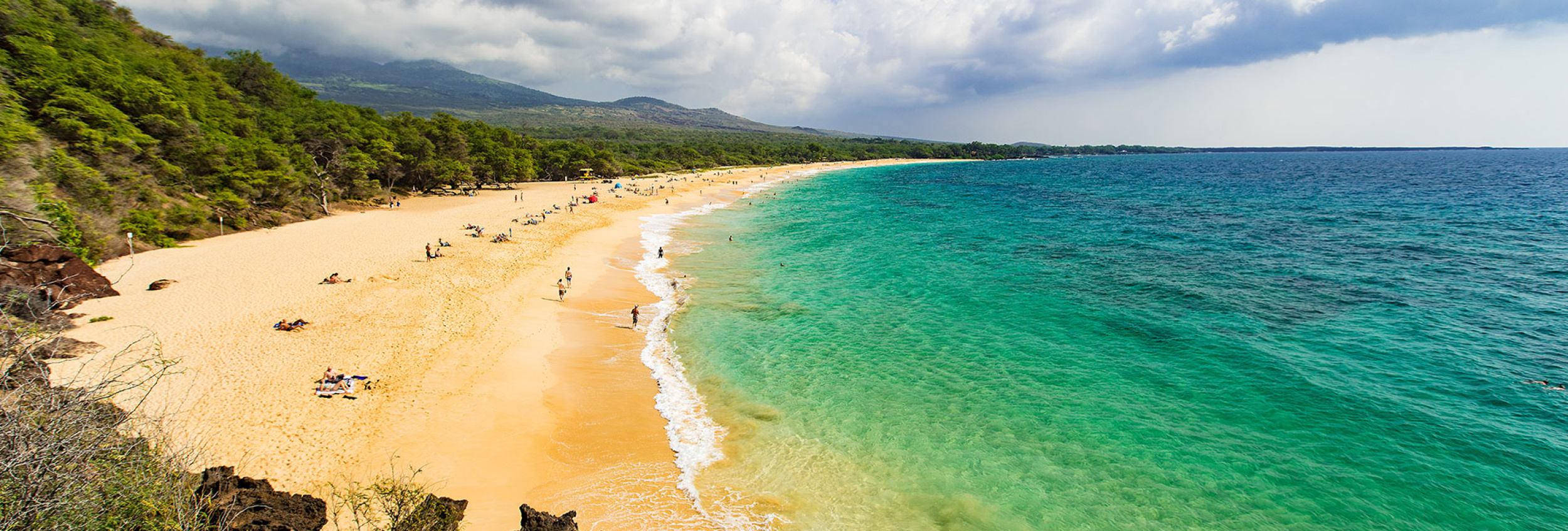 Scenic Maui beach with calm turquoise water, ideal for families with young kids
