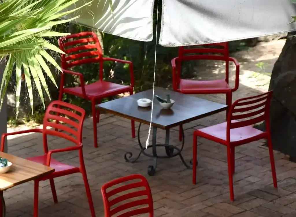 Casual outdoor terrace seating at a lolo, a local grill restaurant in St Martin