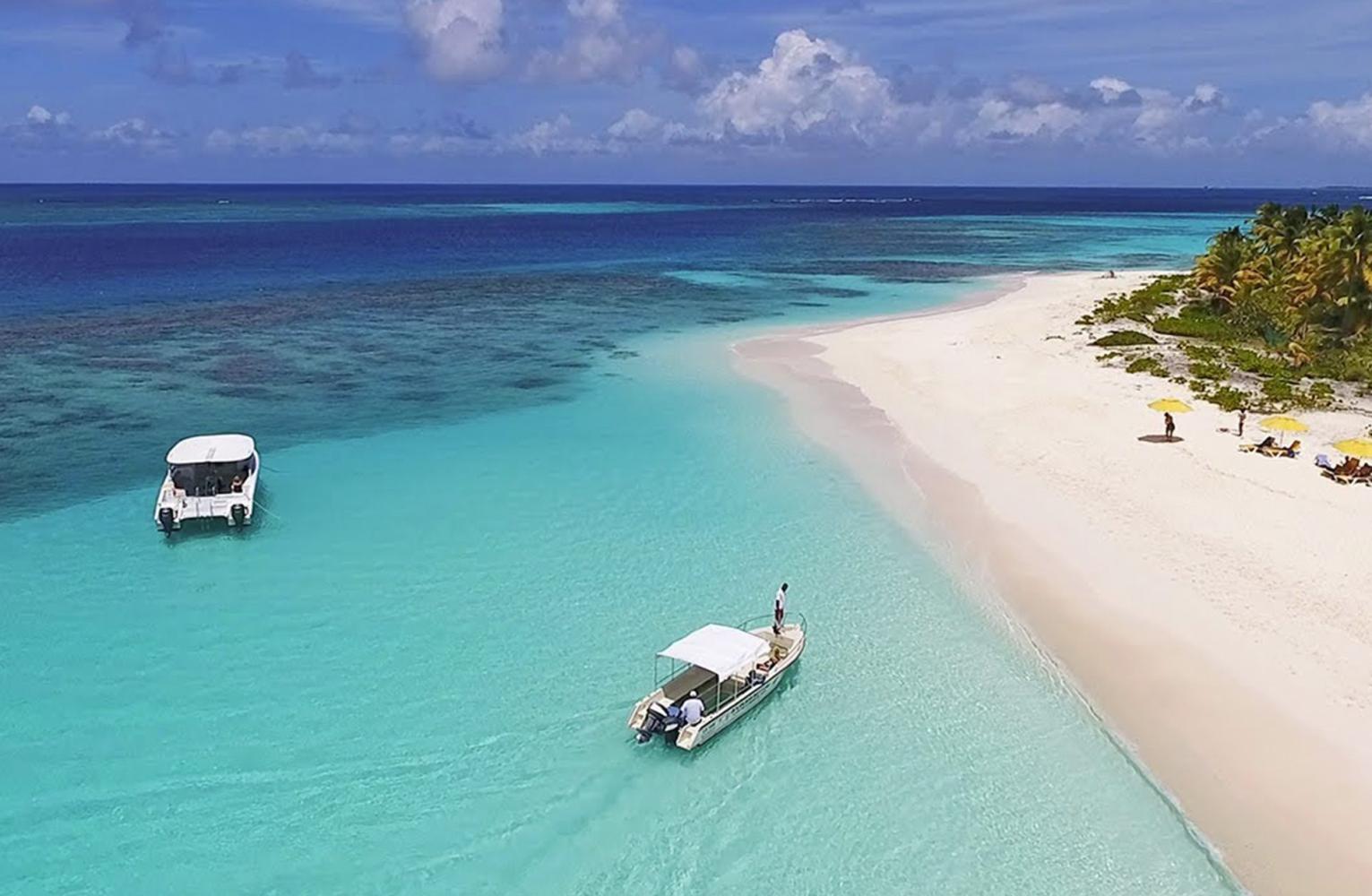 Boats anchored off Shoal Bay, a white sand beach on Anguilla, a short ferry ride from St Martin