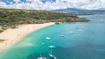 Aerial view of Waimea Bay with sailboats on the North Shore of Oahu