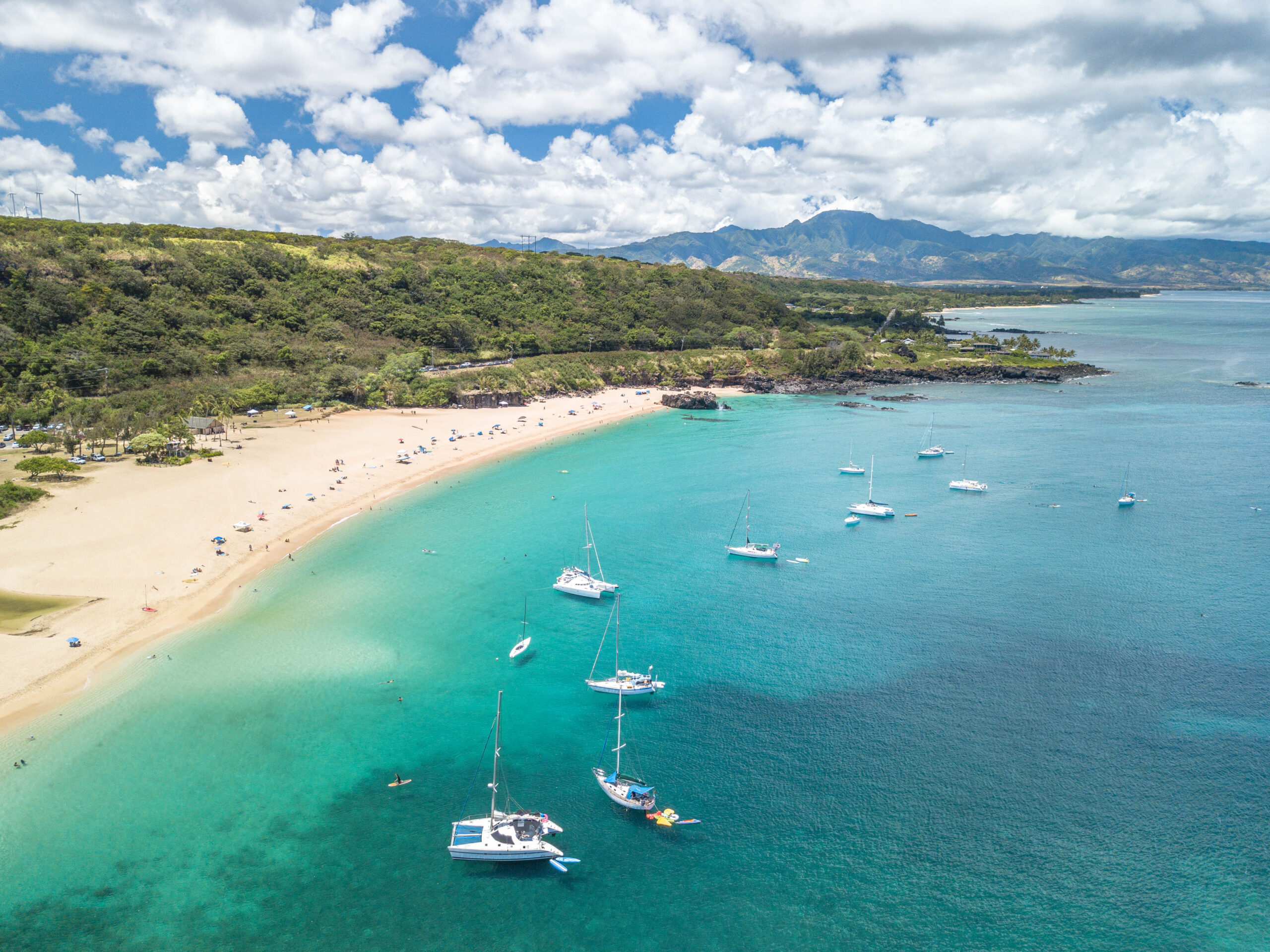 Aerial view of Waimea Bay with sailboats on the North Shore of Oahu